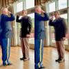 two ROTC cadets saluting