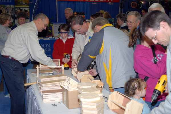 A popular toolbox-construction display requires an assembly-line approach to handle the crowd.