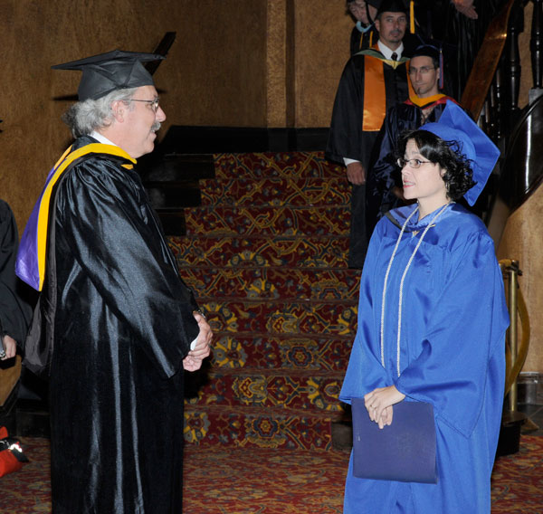 Tom F. Gregory, associate vice president for instruction, talks with student speaker Tammy M. Bergquist.